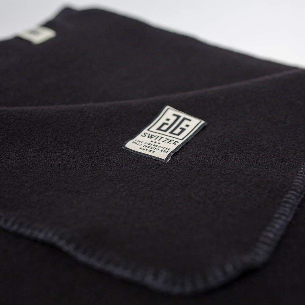 
                      
                        The JG Classic Blanket - Cashmere Blend in Black
                      
                    