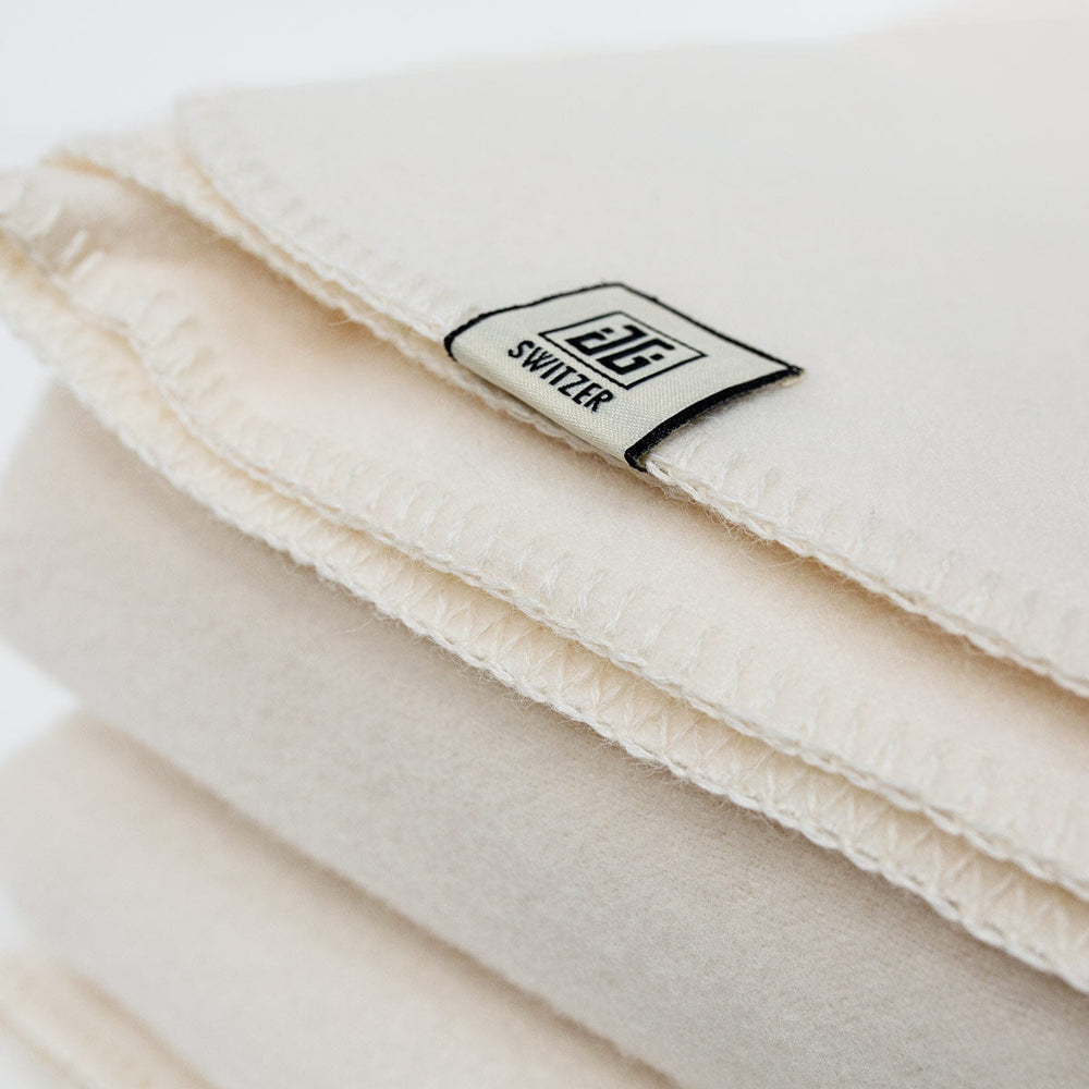 
                      
                        The JG Classic Blanket - White
                      
                    